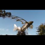 Majestic III Stainless Steel, Bronze & iridized glass flying fish sculpture. 8'x6'x7' 